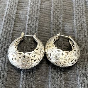 Sterling silver intricate detailed-pierced earrings.